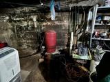 wet basement with dirt floor