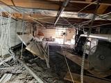 wet crawl space with debris