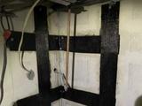 carbon fiber straps installed on poured concrete crawl space walls