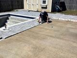 crew member working on level concrete