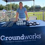 Groundworks employee at a company booth at a Harrisburg Senators game