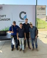 four Groundworks team members holding clay shooting guns at AMX clay shoot sponsorship event