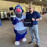 Groundworks member standing with RailRaiders mascot