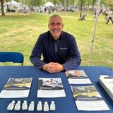Groundworks member at sponsorship booth at New Haven Road Race event