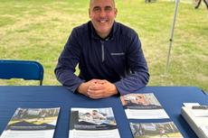 Groundworks member at sponsorship booth at New Haven Road Race event