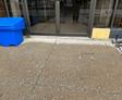 image of settled concrete for the entry way of realty company that created trip hazards before polyurethane injection concrete leveling