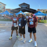 Three Groundworks team members at Houston's 13th Annual Head for the Cure 5K sponsorship
