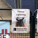 sponsorship sign at the 2025 Running of the Wools