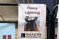 sponsorship sign at the 2025 Running of the Wools