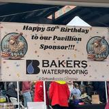 special sign recognizing Groundworks, formerly Baker's Waterproofing, at the 2025 Running of the Wools
