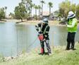 image of Groundworks employees installing grout curtain barrier through injection rods at job site