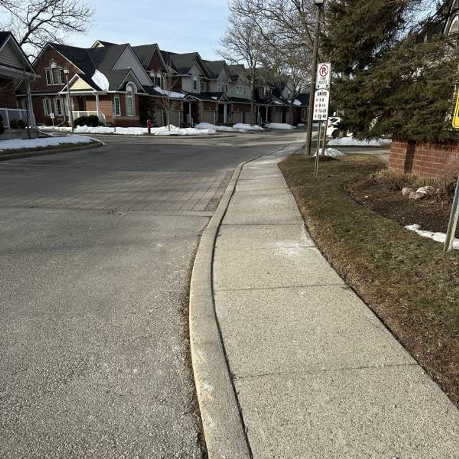 image of uneven sidewalks at condominium where Groundworks performed sidewalk leveling