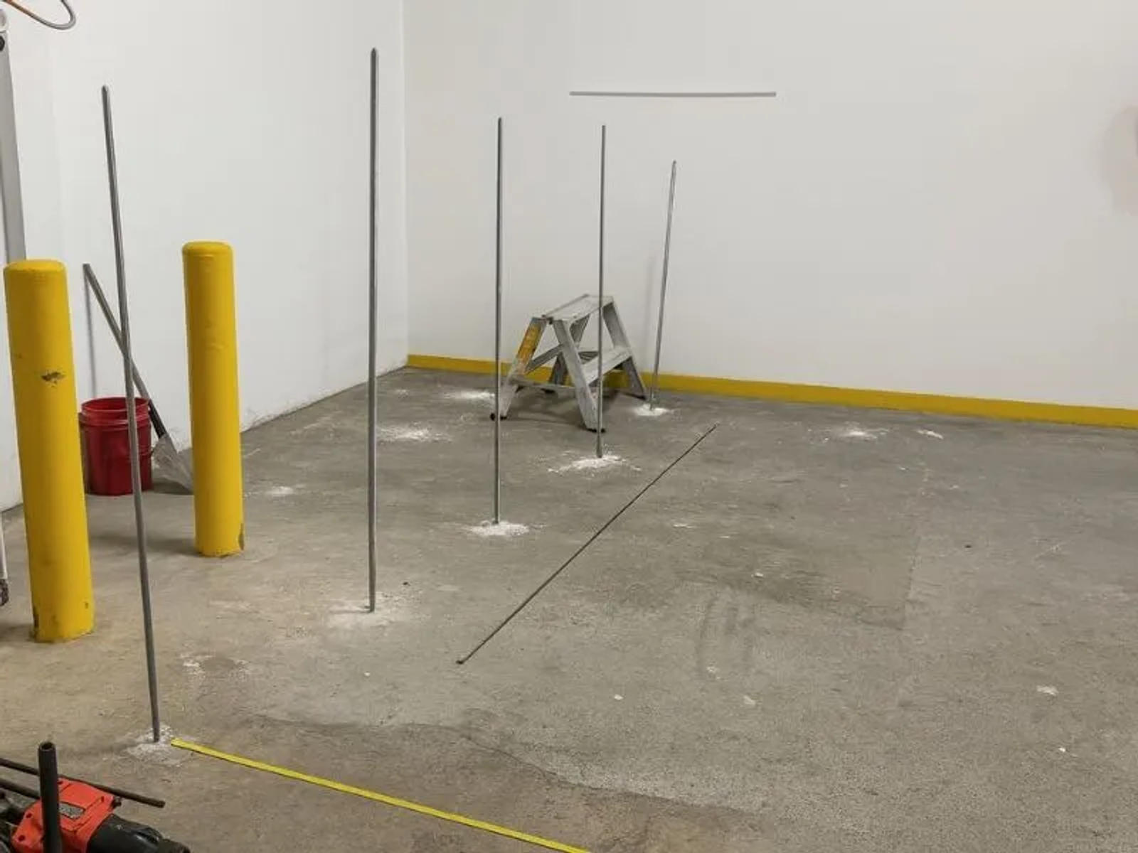 image of injection rods placed in warehouse floor for deep soil injection and soil densification from Groundworks