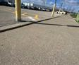 image of sunken concrete trip hazards at big box store before Groundworks performed polyurethane injection concrete leveling for trip hazard repair