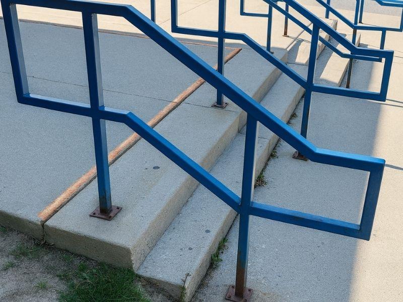 image of stairs at elementary school before concrete leveling and trip hazard repair from Groundworks