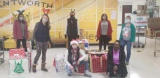 teammates from Groundworks' Pittsburgh branch, formerly Baker's Waterproofing, stand with donations made to the Bentworth School District