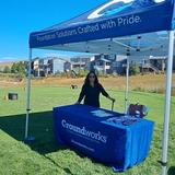 A Groundworks Denver teammate staffs a company booth at the Links for Lungs Golf Tournament