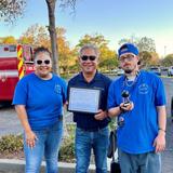 a Groundworks Fairfield teammate with other attendees at the Connections for Life Backlot BBQ