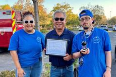 a Groundworks Fairfield teammate with other attendees at the Connections for Life Backlot BBQ