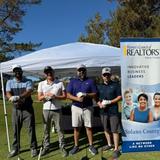 a group of four Groundworks Fairfield teammates participating in the Northern Solano County Association of Realtors' 19th Annual Golf Tournament