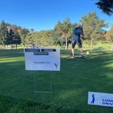 a golfer swings near a hole sponsored by Groundworks during the Northern Solano County Association of Realtors' 19th Annual Golf Tournament