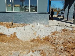 image of rods driven into the soil to inject polyurethane grout curtain wall