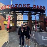 Two Groundworks team members wearing brand jackets at St. Jude Memphis Marathon Weekend sponsorship event