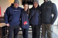 Four Groundworks team members wearing brand jackets at St. Jude Memphis Marathon Weekend sponsorship event