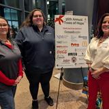 Three Groundworks New Haven crew members at RMHC Trees of Hope 2025 sponsorship event standing with fundraiser sign