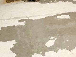 image of water pooling on concrete floor