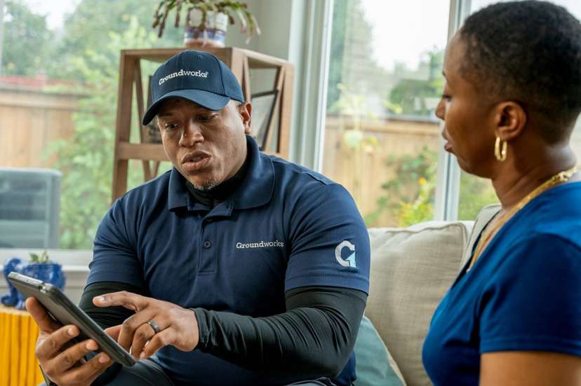 technician reviewing information with a homeowner