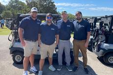 Employees from Tar Heel Basement Systems' (now Groundworks Raleigh) Raleigh Branch participate in the Corinth Holders Pirate Booster Club Golf Tournament