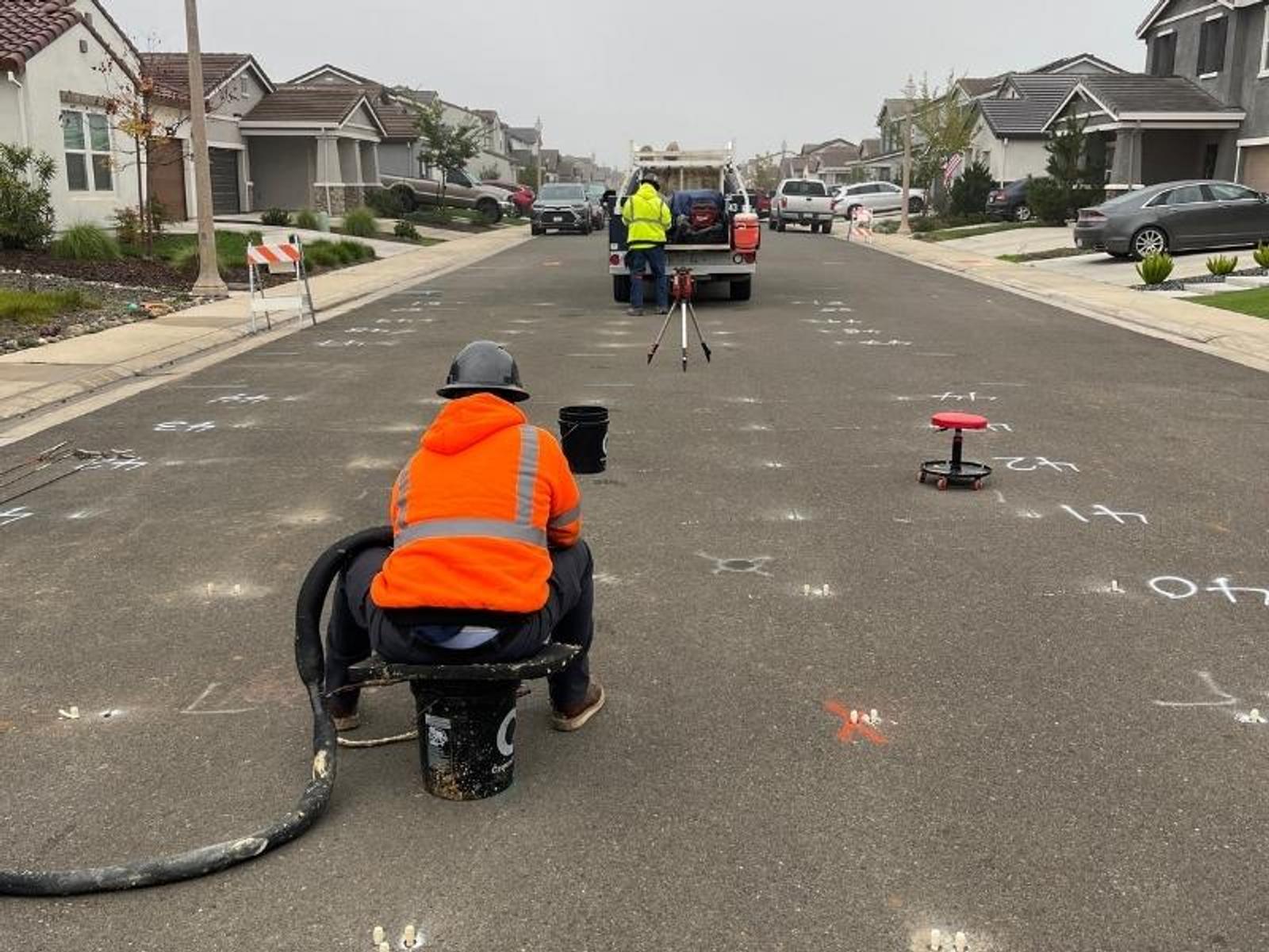 image of Groundworks employees drilling holes in a grid pattern for polyurethane injection soil stabilization