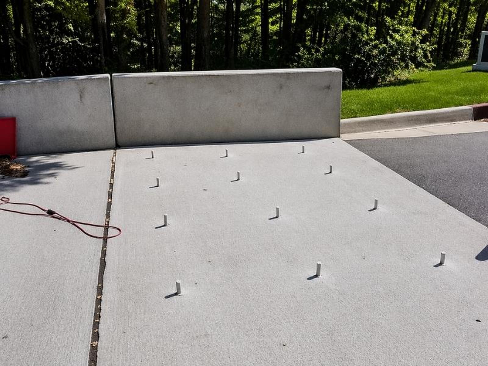 image of injection ports placed to inject polyurethane for void filling and bridge transition slab lifting