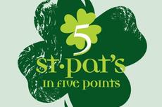 Green four-leaf clover with "5 st. pat's in five points" written in yellow and green text.
