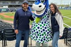 Groundworks New Haven employees with a mascot at a Hartford Yard Goats baseball game