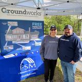 Groundworks employees stand at a company booth at Walk for Wishes 2026 at the Detroit Zoo