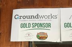 a Groundworks Pittsburgh sponsorship banner on display at the Log Cabin Cares Sporting Clay Benefit