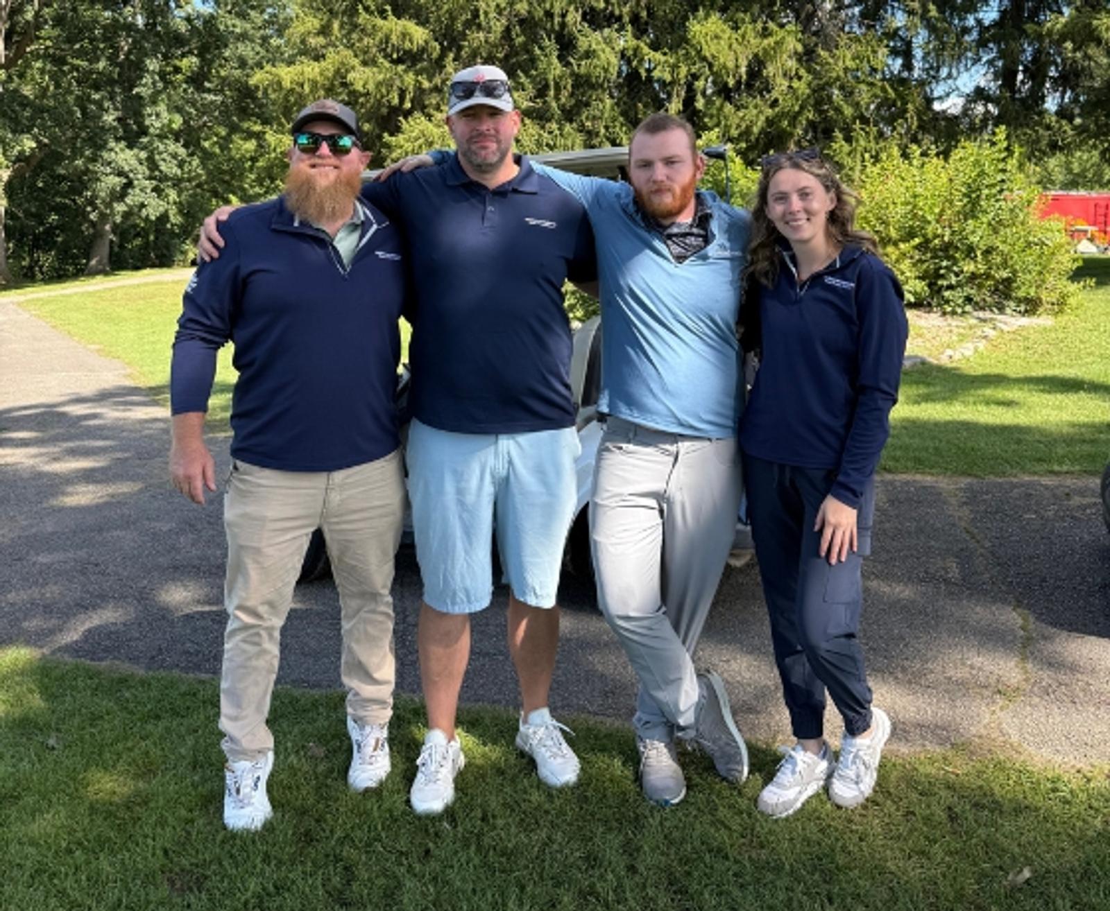Four of Ohio Basement Authority's Cleveland branch employees at the Linda Horning Memorial Golf Outing
