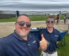 Two smiling Ohio Basement Authority team members at Tequila Fest
