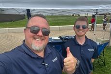 Two smiling Ohio Basement Authority team members at Tequila Fest