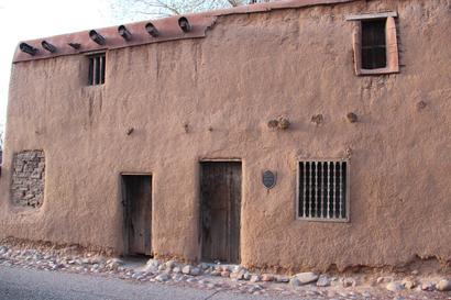 De Vargas Street House in Santa Fe, New Mexico, a historic adobe home with thick earthen walls and traditional Pueblo-style construction.