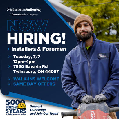 Bearded man in work clothes with a power tool; "Now Hiring!" job ad for installers & foremen at Ohio Basement Authority.