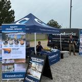 Groundworks Bozeman employees stand at a company booth at the Big Sky Country State Fair