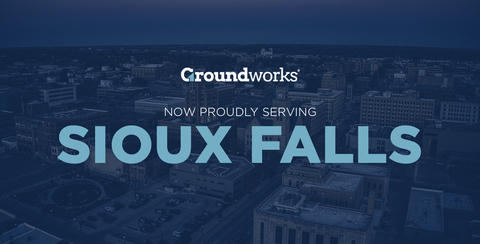 A city skyline at dusk with the text: "Groundworks now proudly serving Sioux Falls" overlaid.