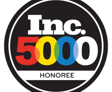 Inc. 5000 Honoree logo with bold, colorful numbers and letters on a black circular background.