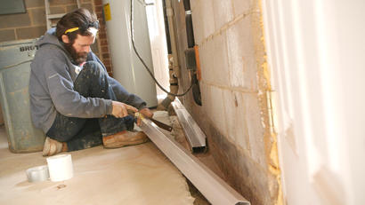Crew Installing Interior Drainage