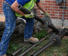Crew picking up helical pier
