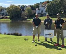 Three Dry Pro workers golf.