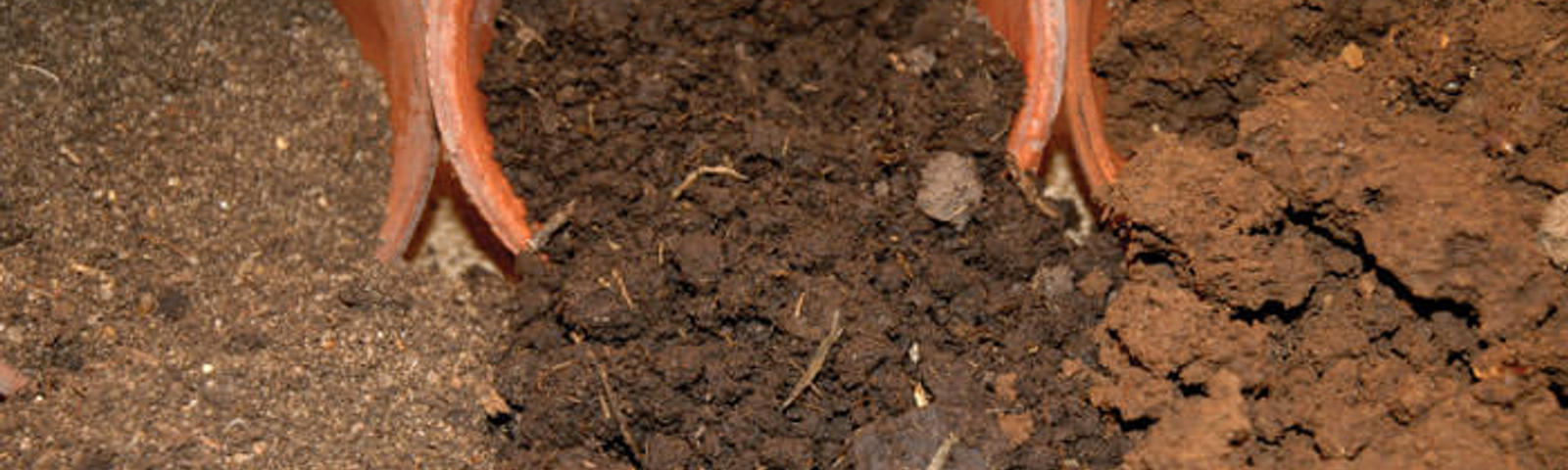 Sand, loam and clay soils spilling out of pots